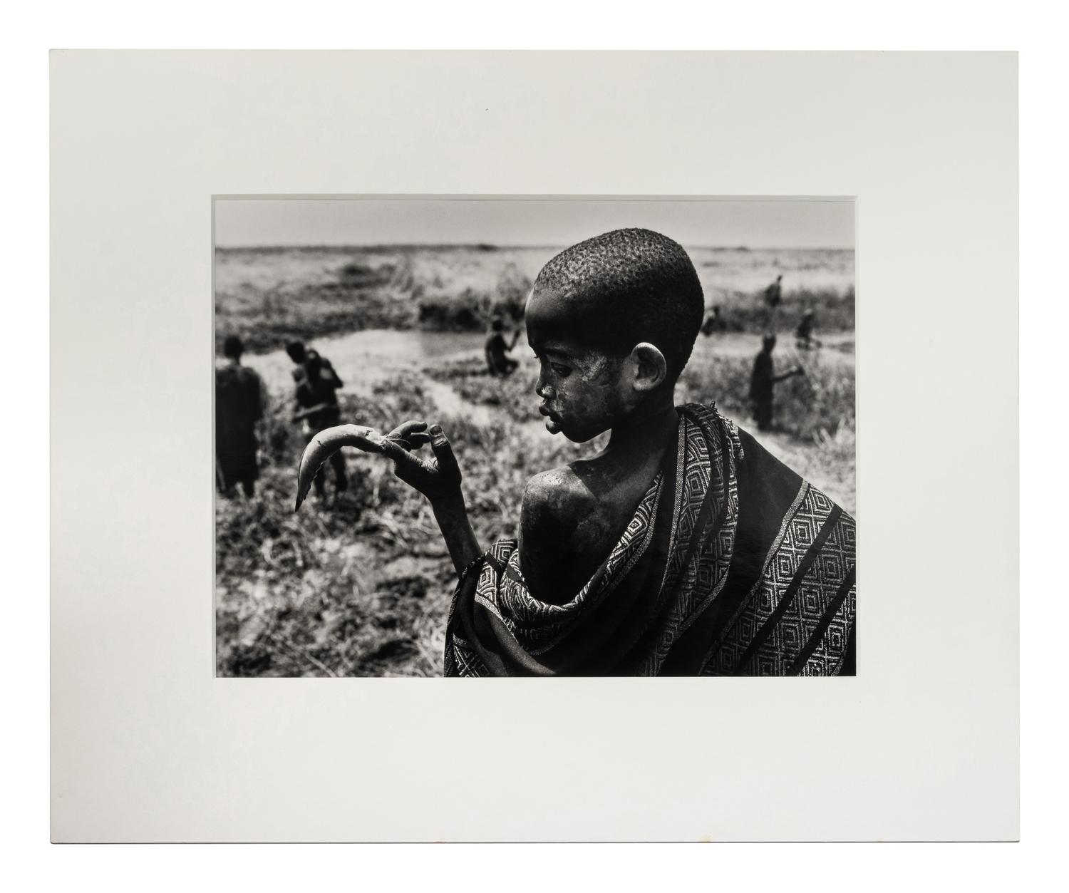 Sebastião Salgado (born 1944) Fishing in the marshes of the Gel Canal, which is filled with waters from the Nile River, Southern Sudan, from the series "Genesis," 2006
