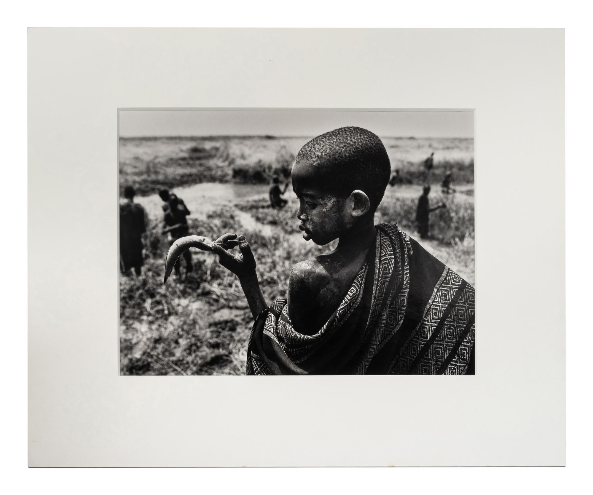 Sebastião Salgado (born 1944) Fishing in the marshes of the Gel Canal, which is filled with waters from the Nile River, Southern Sudan, from the series "Genesis," 2006