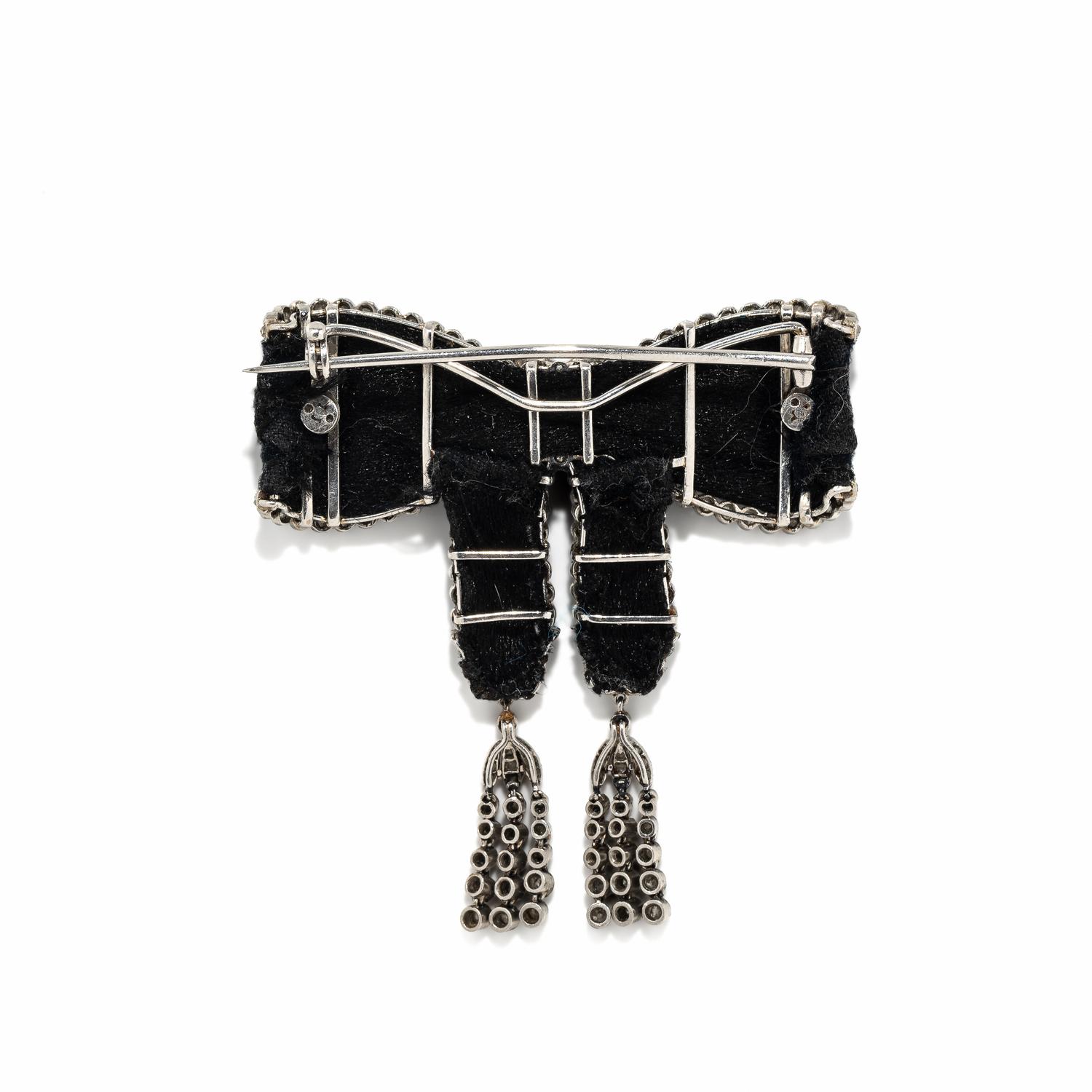 ART DECO, BLACK RIBBON, DIAMOND, AND PLATINUM BOW BROOCH