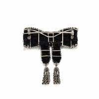 ART DECO, BLACK RIBBON, DIAMOND, AND PLATINUM BOW BROOCH