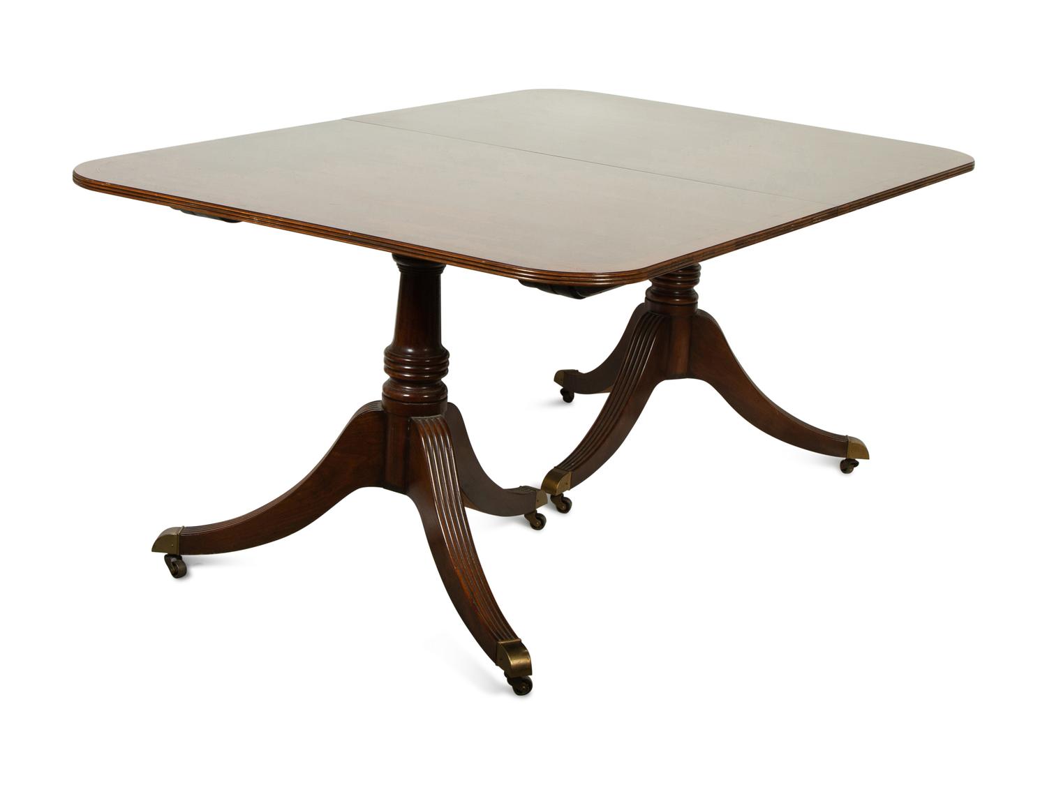 A Baker George III Style Mahogany Double-Pedestal Dining Table
