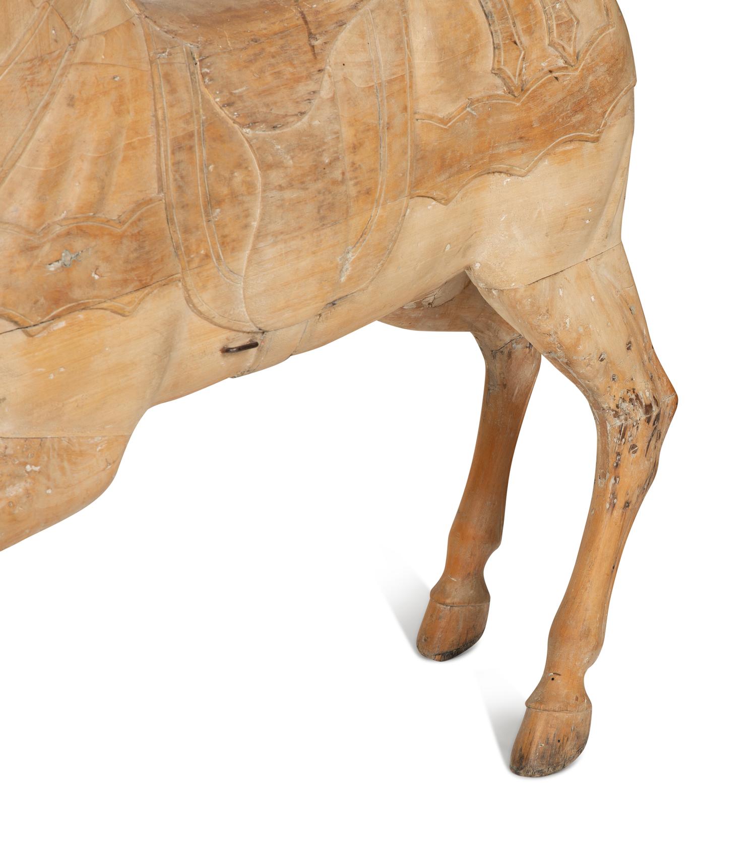 A Pair of Italian Carved Wood Carousel Horses in the Manner of Gustav Dentzel