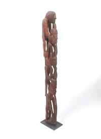 An Asmat Figure COMBINED WITH 31