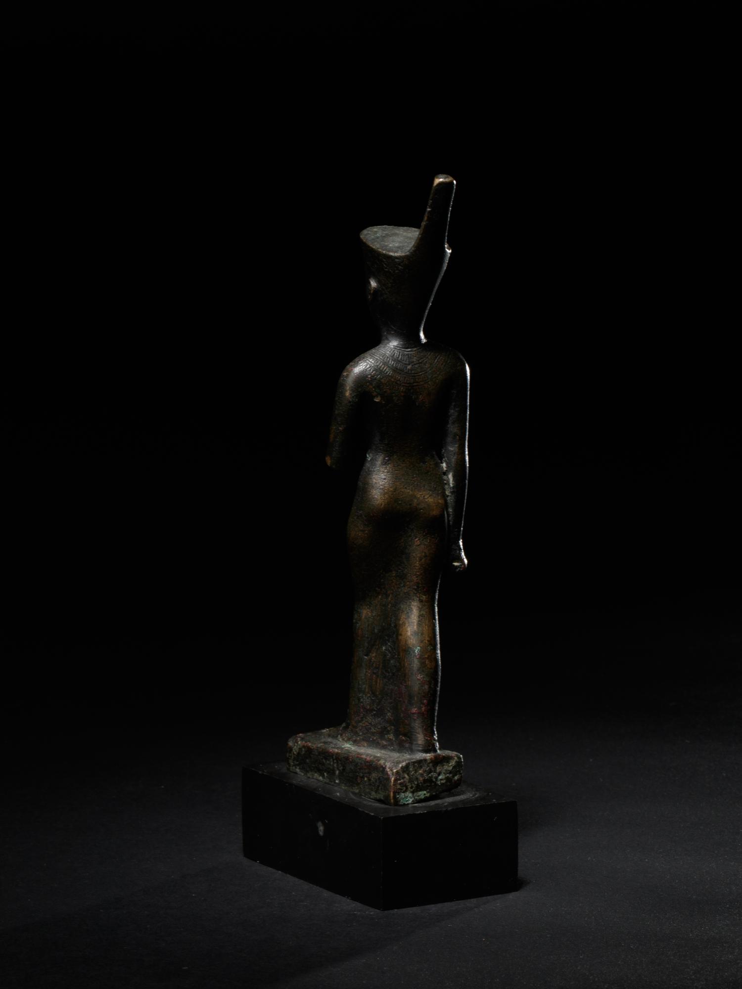 An Egyptian Bronze Striding Neith