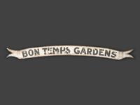 A Painted Wood 'Bon Temps Gardens' Advertising Sign