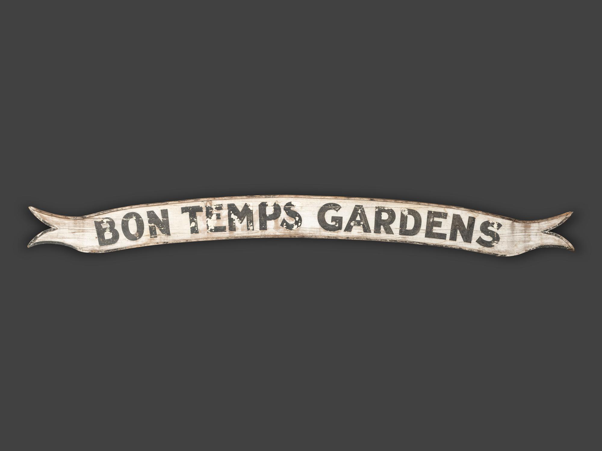 A Painted Wood 'Bon Temps Gardens' Advertising Sign