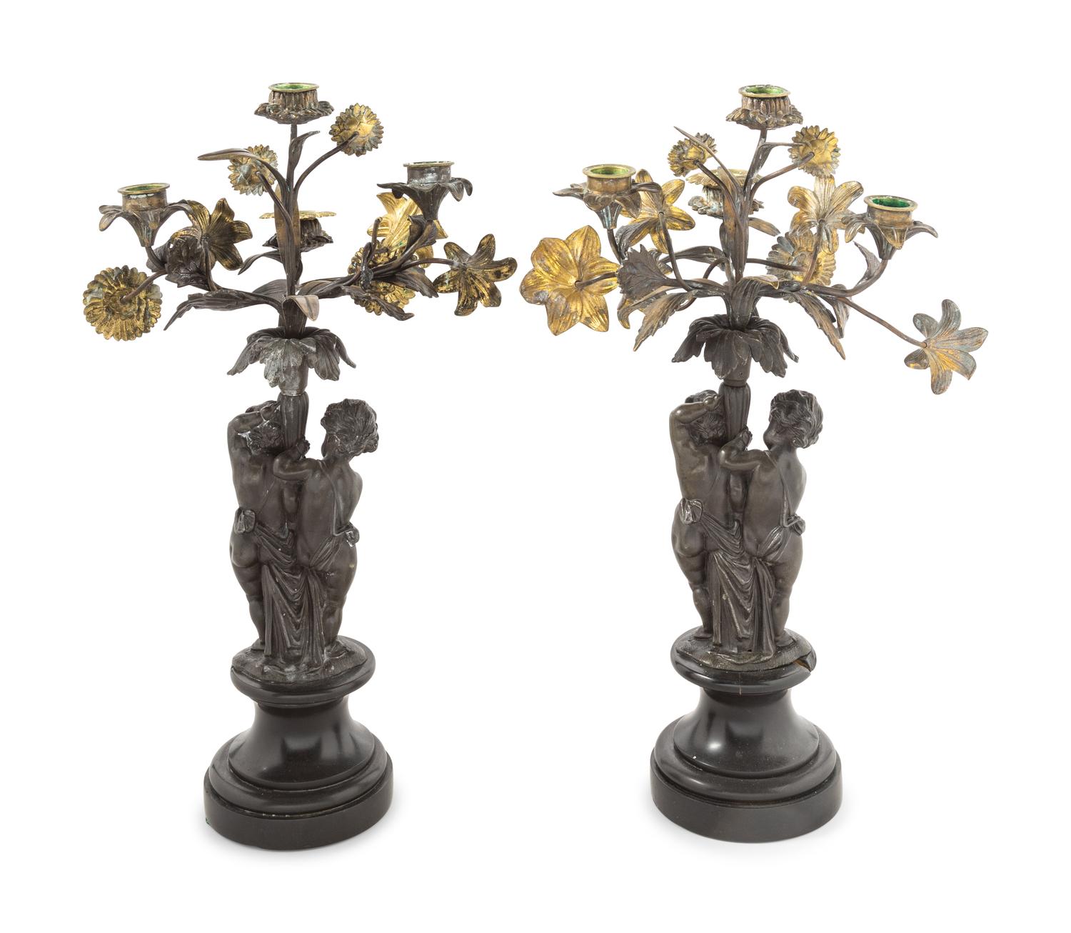 A Pair of Victorian Cast Metal and Parcel Gilt Four-Light Candelabra