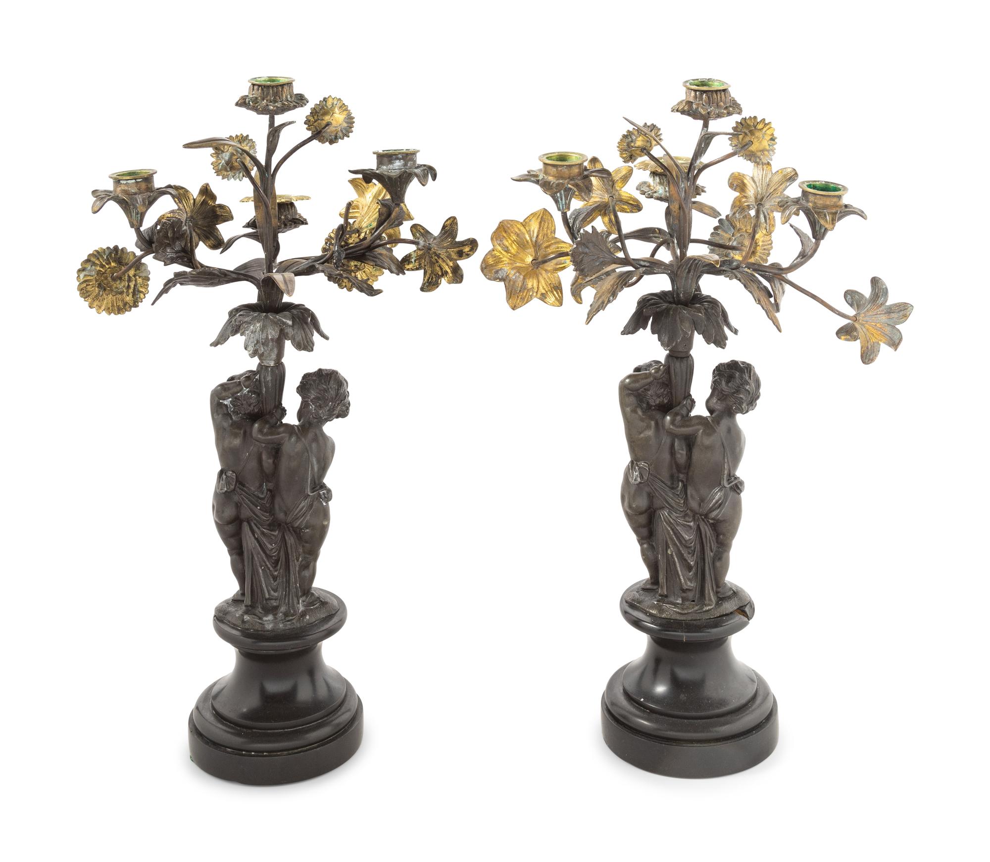 A Pair of Victorian Cast Metal and Parcel Gilt Four-Light Candelabra