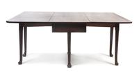 A George III Mahogany Gate-Leg Table, Height 27 1/2 x width 65 x depth 50 3/4 inches (open).