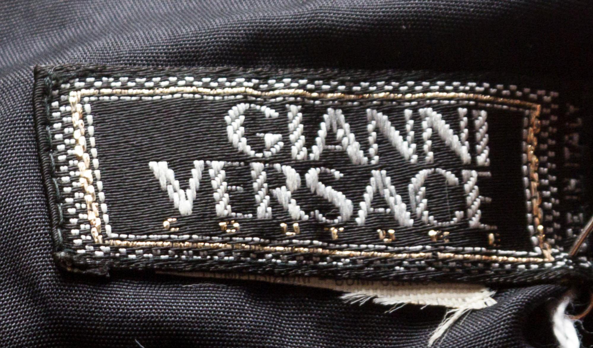 A Gianni Versace Leather Embellished Vest with Silk Tie Front, Size 40.