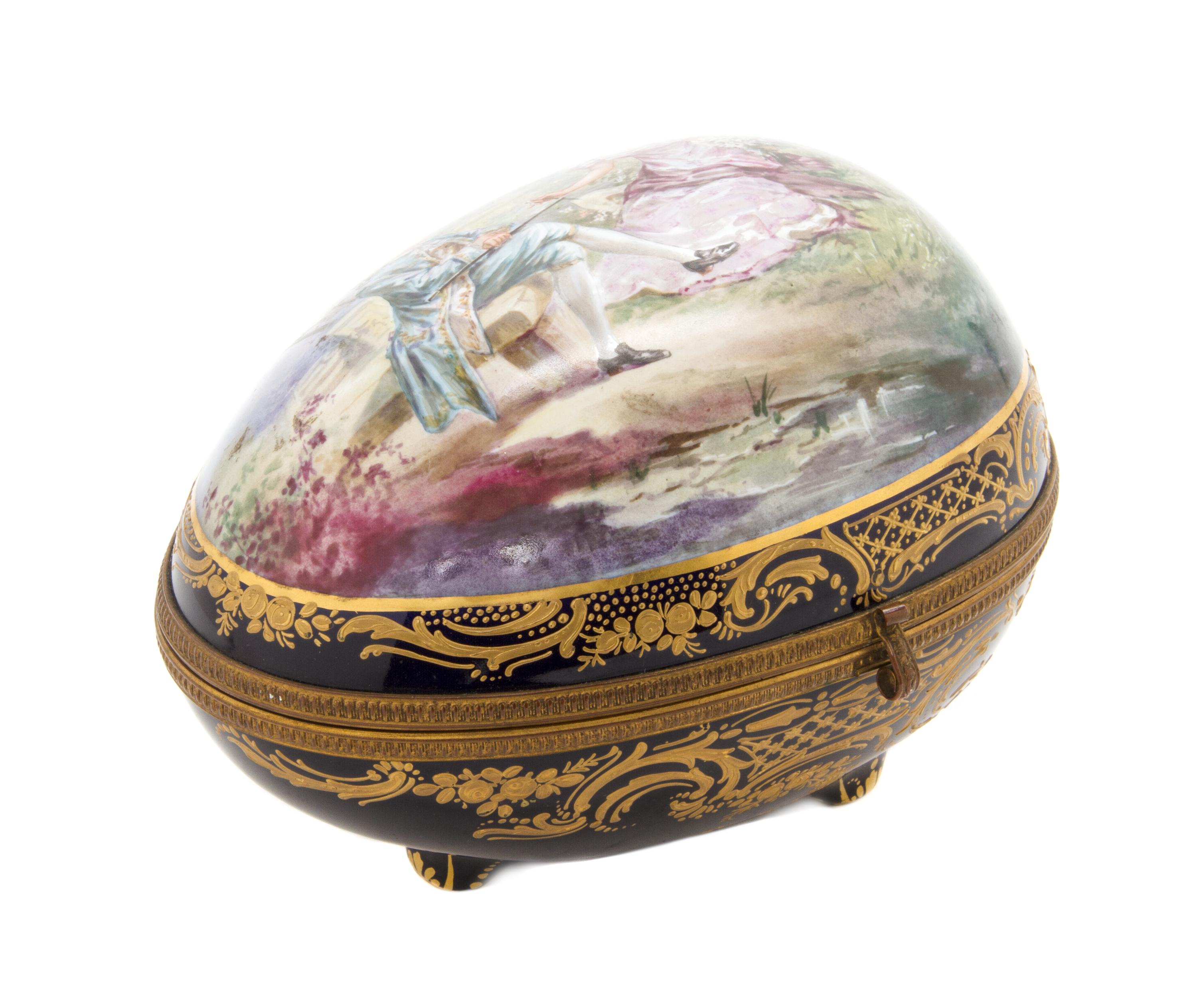 A Sevres Style Porcelain Table Casket, Height 6 3/4 x width 8 1/2 inches.