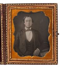 [EARLY PHOTOGRAPHY]. 2 daguerreotypes of men in cases bearing British emblems.