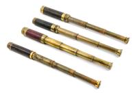 A Group of Four Leather Body Three-Draw Hand Telescopes Length of longest 6 5/8 inches (closed).
