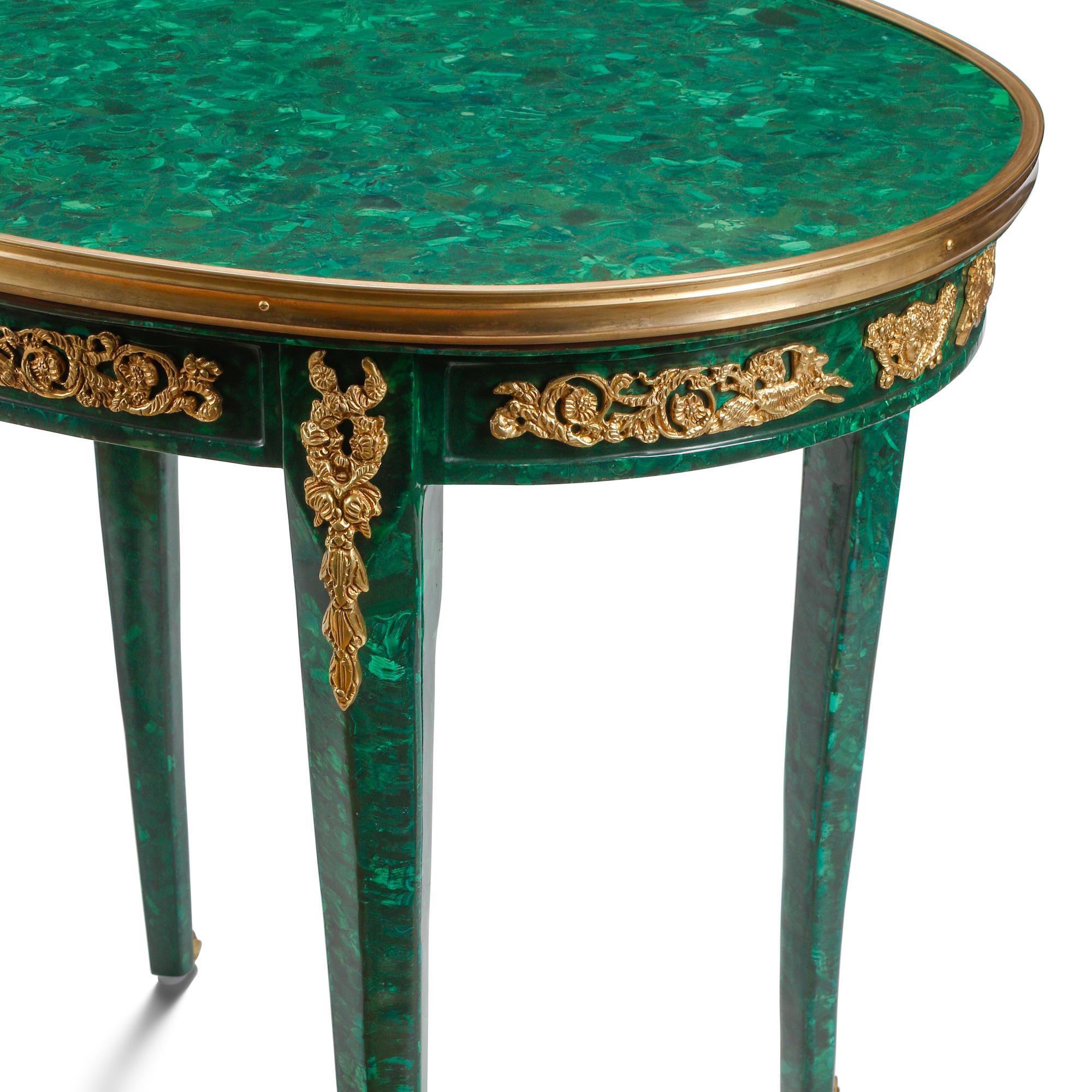 A Pair of Louis XV Style Malachite Veneered and Gilt Bronze Mounted Tables