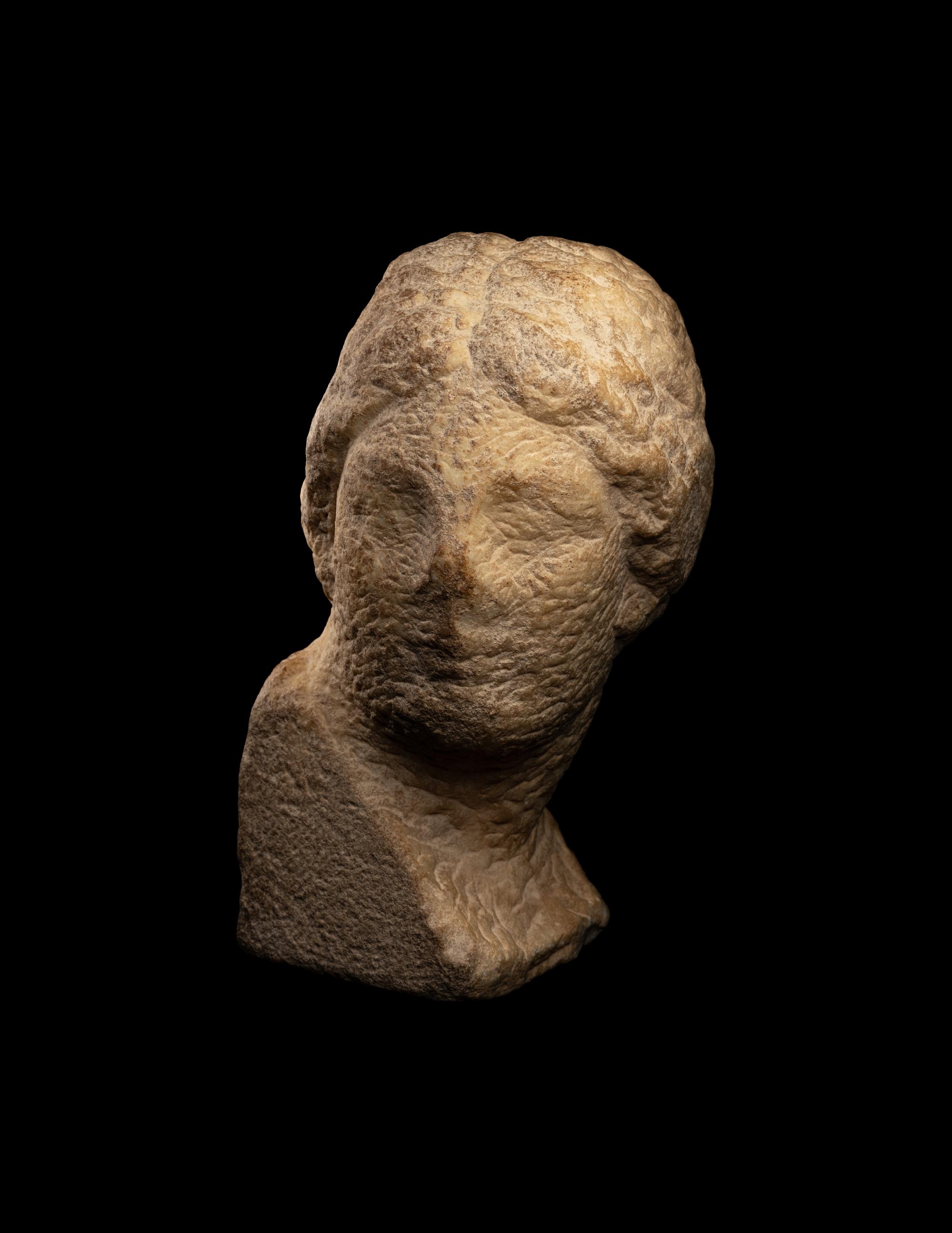 An Unfinished Greek Marble Head of a Woman