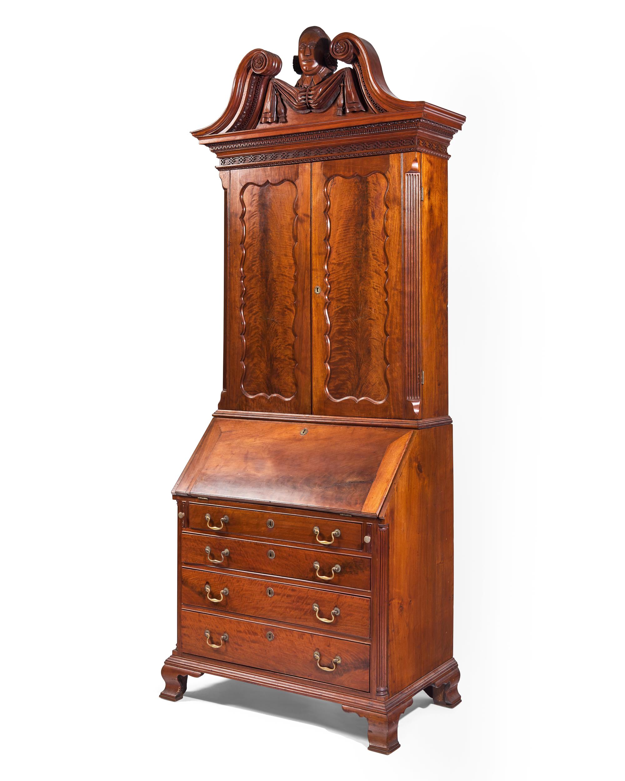A Chippendale Carved Walnut Desk And Bookcase