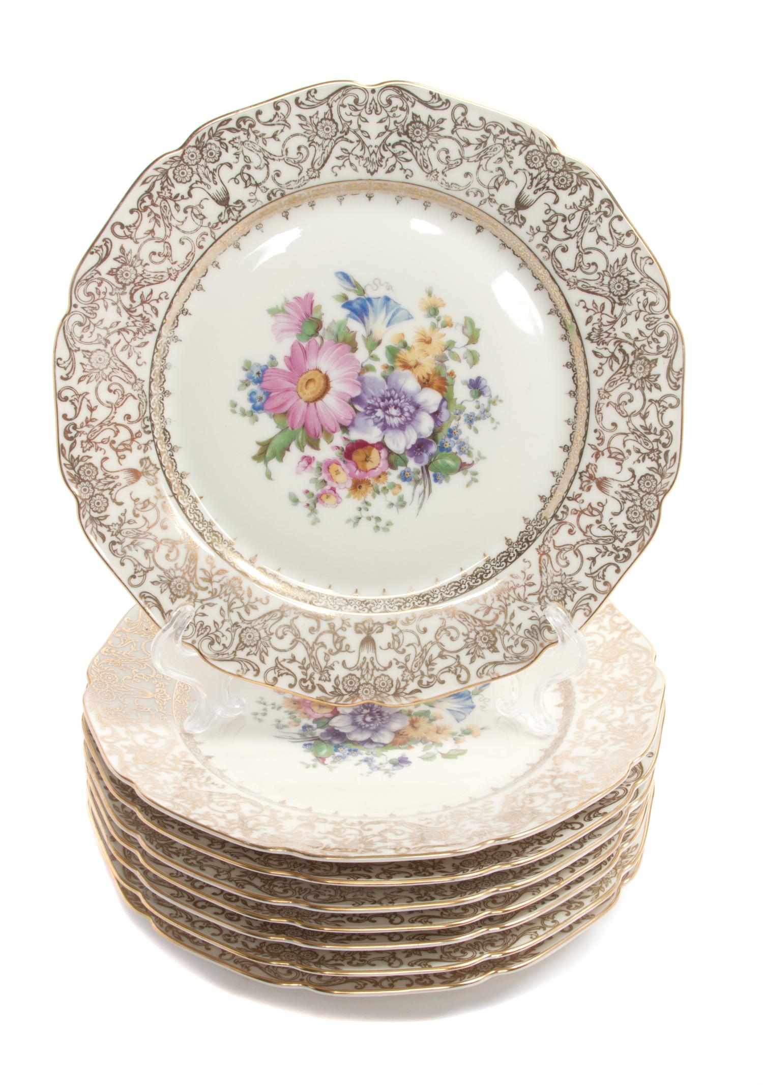 A Set of Eight Bohemia Royal Ivory Porcelain Dinner Plates Diameter 10 5/8 inches.