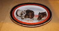 A Painted Porcelain Platter. Width 19 1/2 inches.