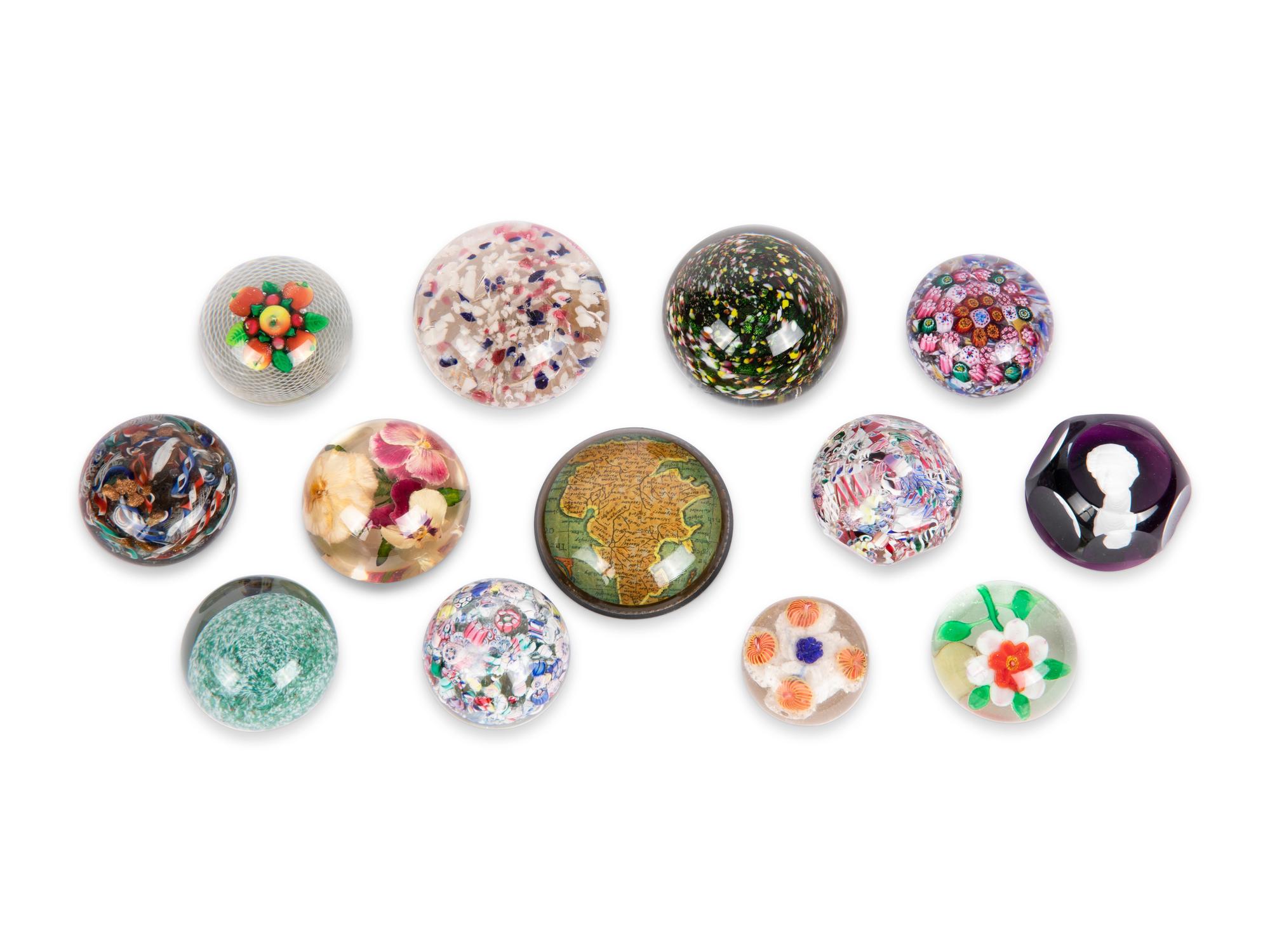 A Group of Thirteen Glass Paperweights