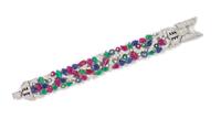 A White Gold, Diamond, Carved Ruby, Sapphire and Emerald Bracelet, 40.20 dwts.