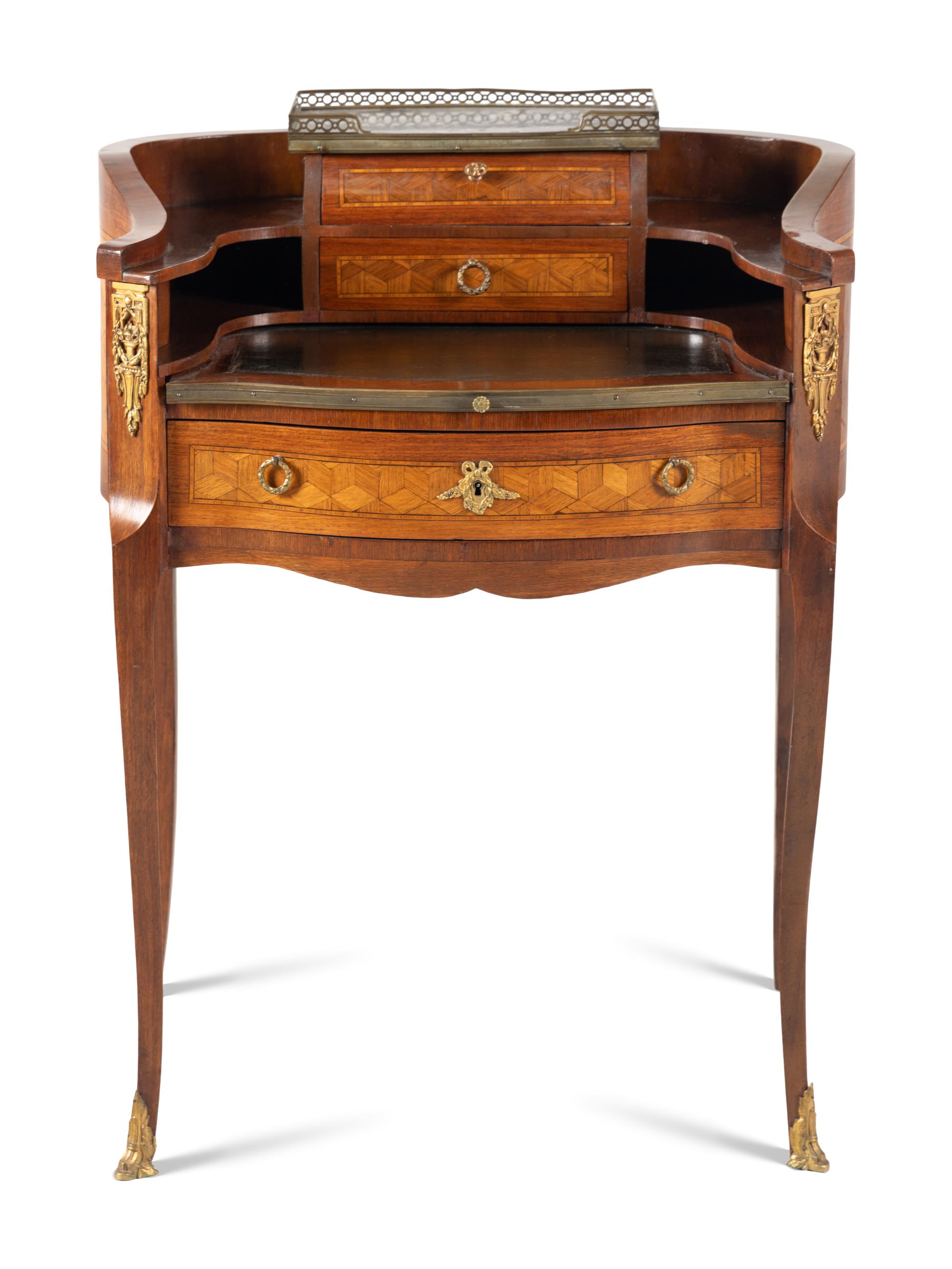 A Louis XV/XVI Transitional Style Gilt Metal Mounted Parquetry Writing Table