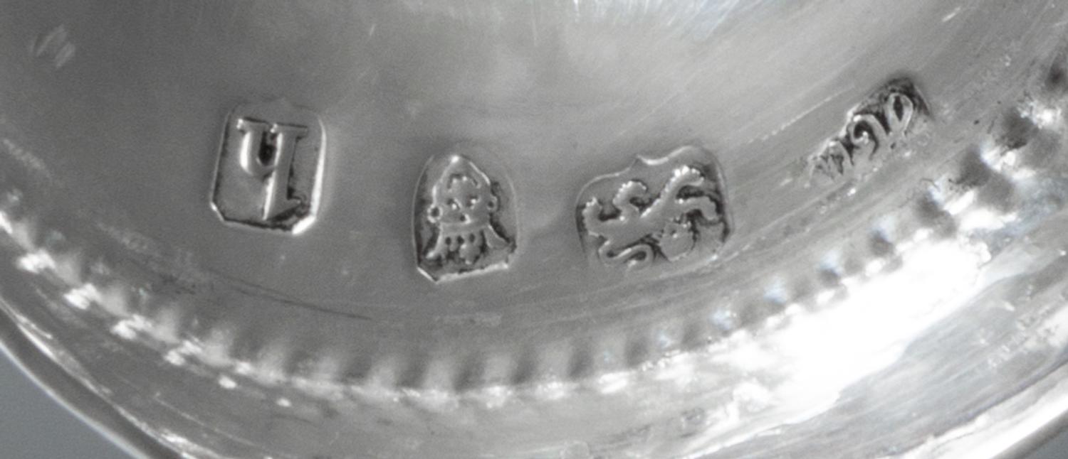 A George III Silver Caster, Hester Bateman, London, 1783, having a spiral twist finial and beaded edges.