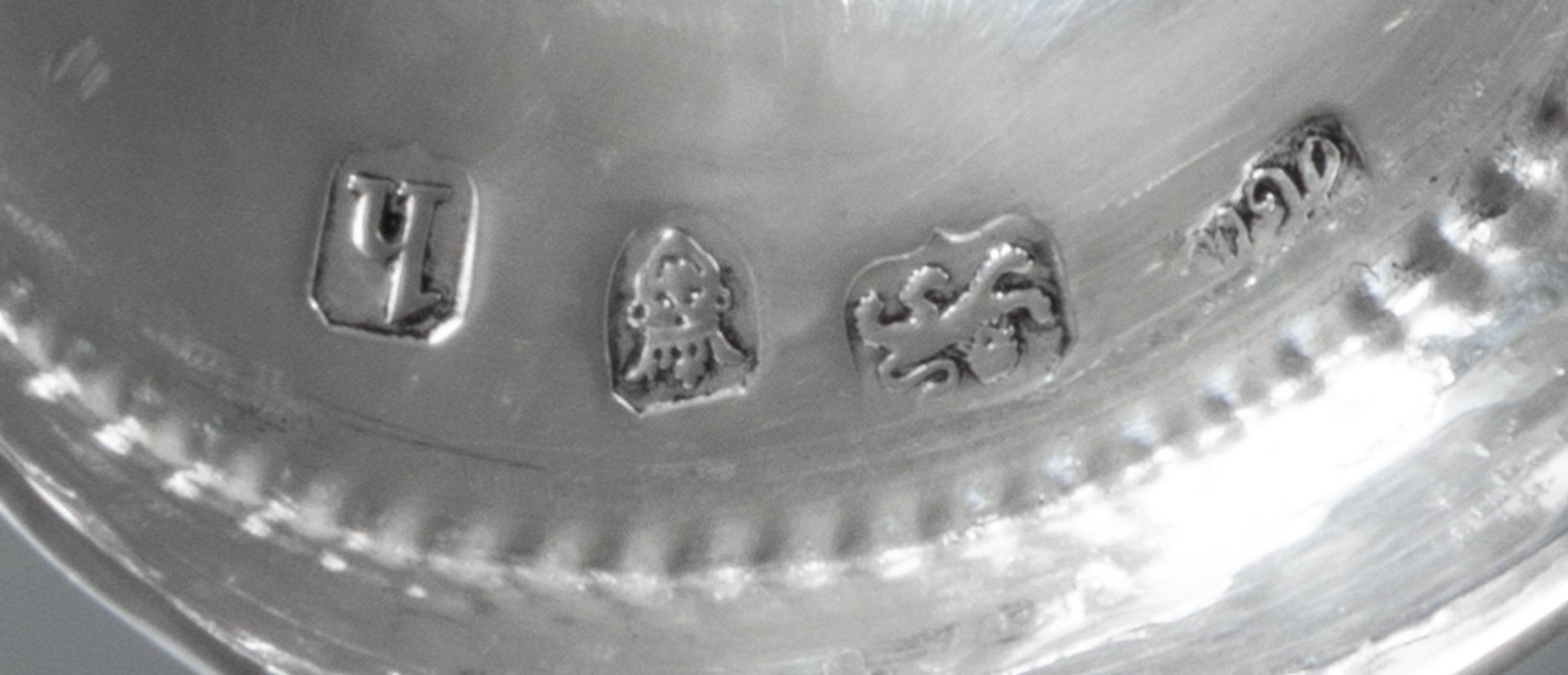 A George III Silver Caster, Hester Bateman, London, 1783, having a spiral twist finial and beaded edges.