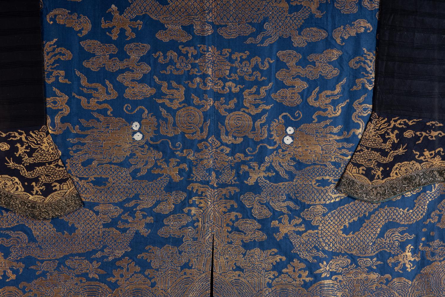 A Chinese Blue Ground Woven Dragon Robe, Jifu