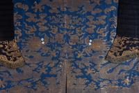 A Chinese Blue Ground Woven Dragon Robe, Jifu