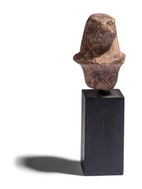 An Egyptian Stone Wadj Fragment with the Head of a Falcon