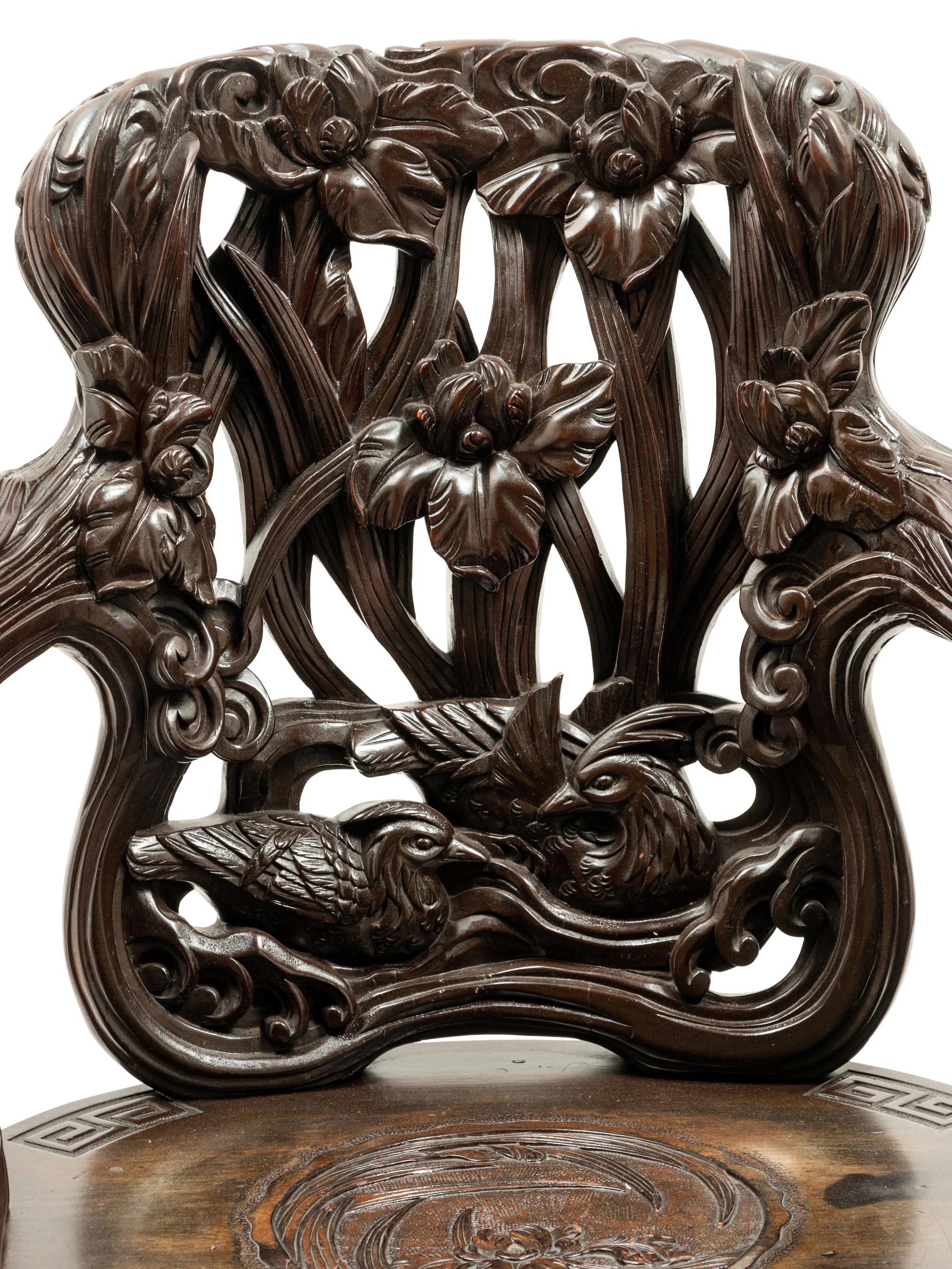 A Chinese Export Carved Hardwood Armchair