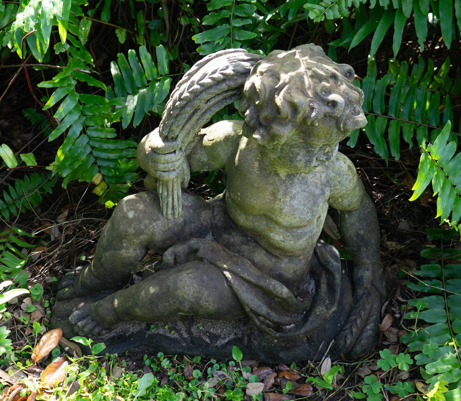 A Pair of Cast Stone Seated Putti