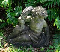 A Pair of Cast Stone Seated Putti