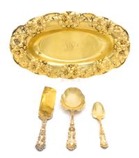 An American Silver-Gilt Ice Cream Service, Gorham Mfg. Co., Providence, RI, retailed by Spaulding, the handles decorated with floral an