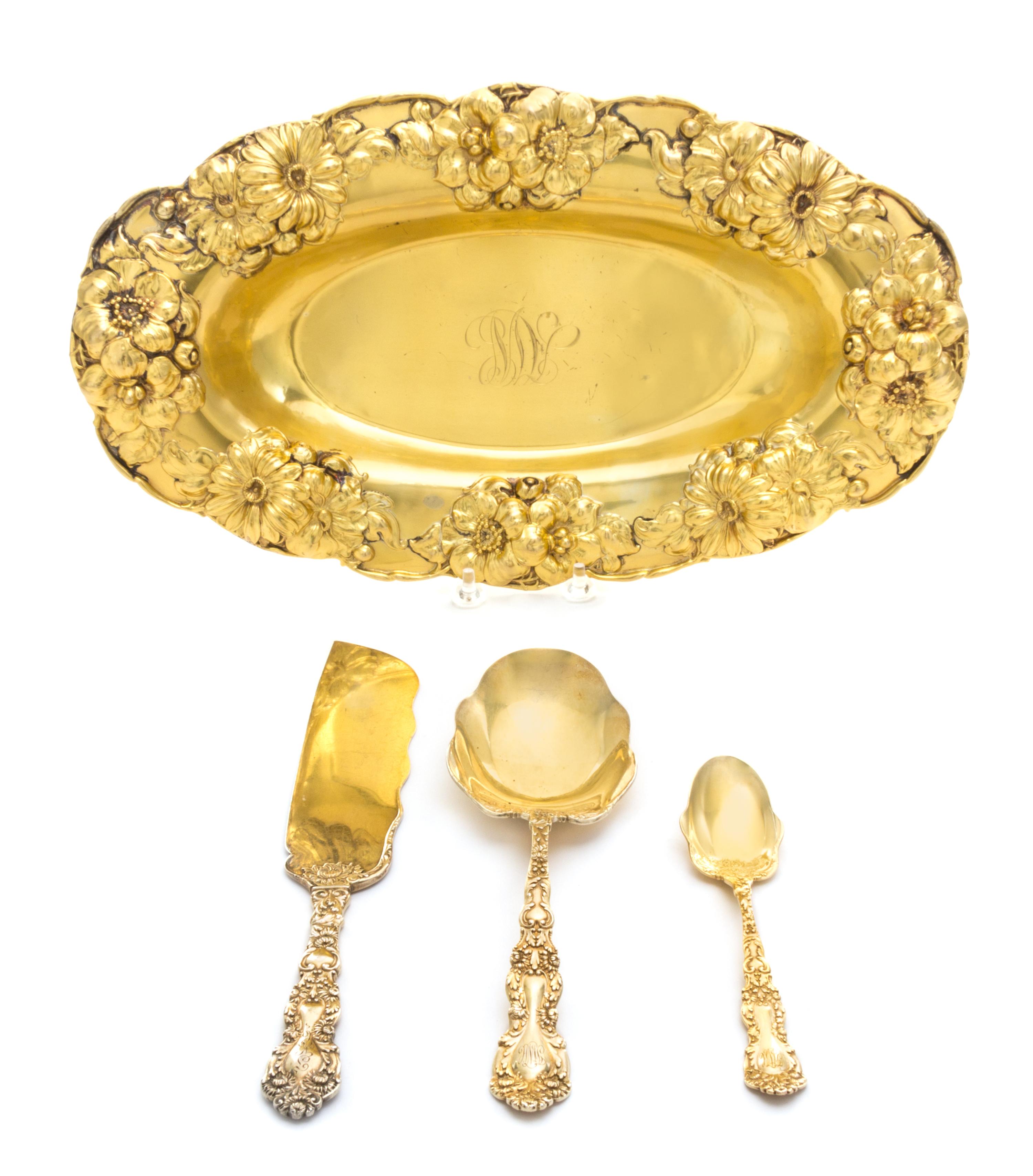 An American Silver-Gilt Ice Cream Service, Gorham Mfg. Co., Providence, RI, retailed by Spaulding, the handles decorated with floral an