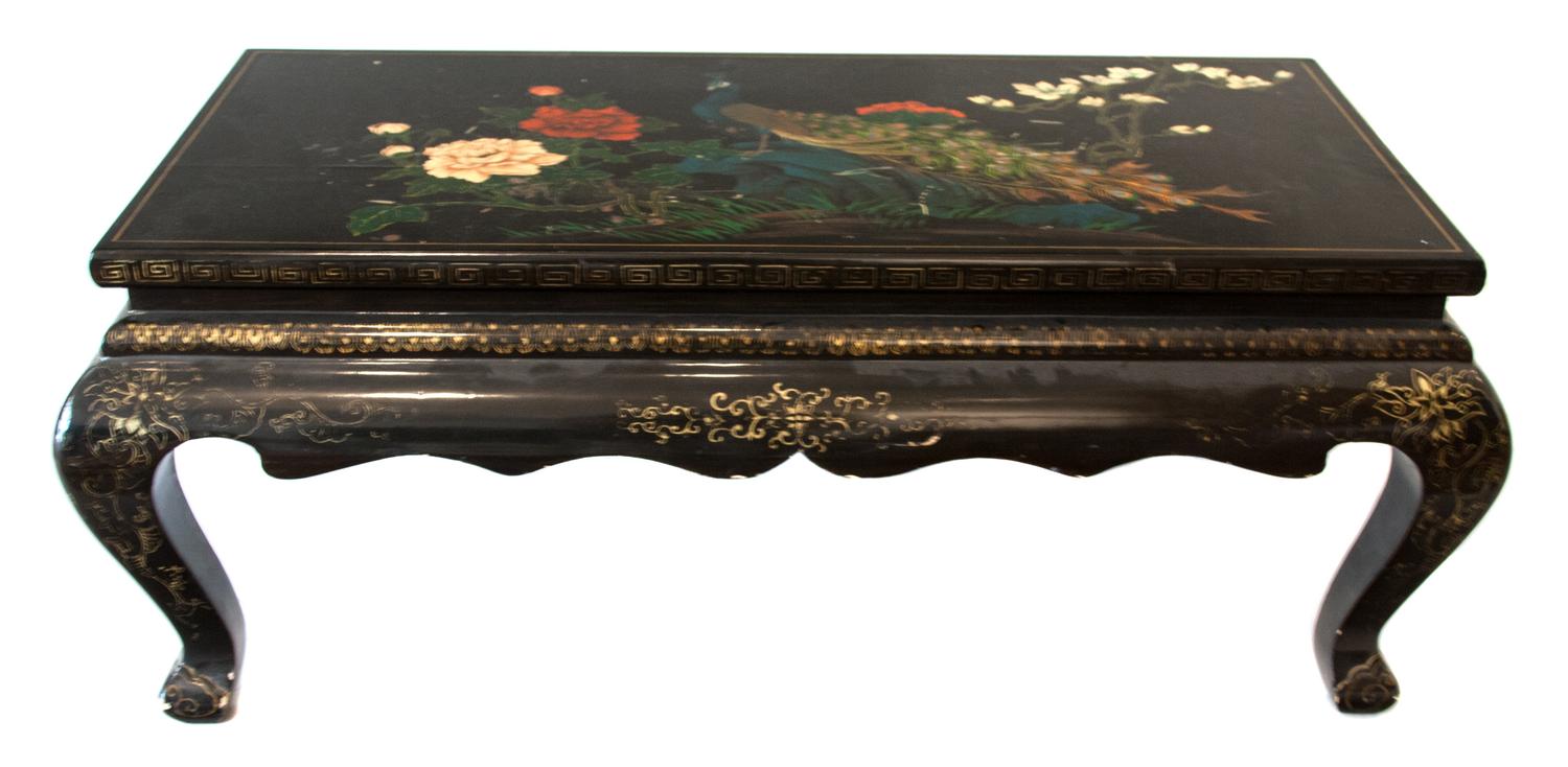 A Black and Flowered Chinese Lacquered Low Table Height 17 x width 41 x depth 21 inches.