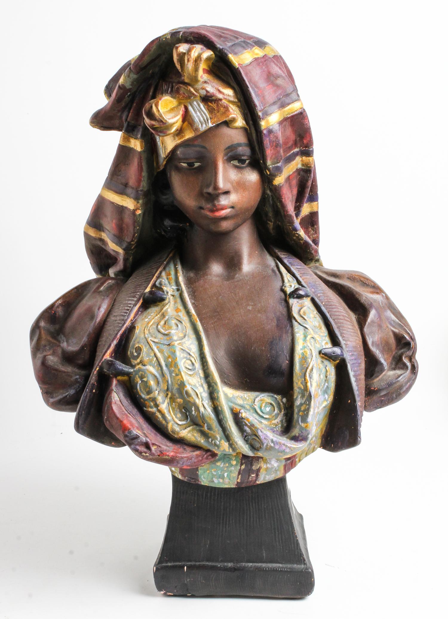 A Painted Wood Bust of an Arab Woman Height 19 1/2 inches. — 20TH CENTURY