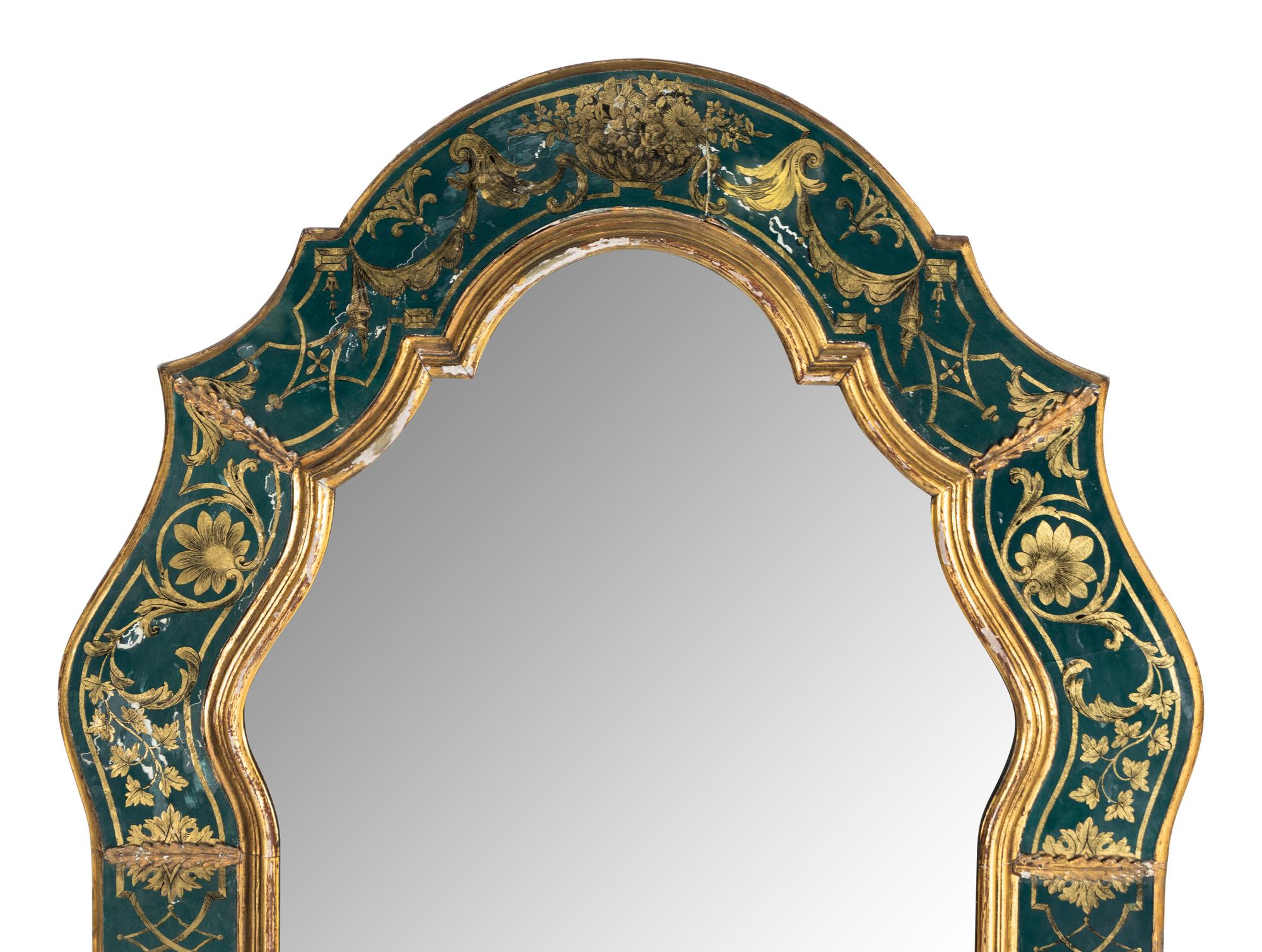 A Baroque Style Reverse Painted Glass and Giltwood Mirror
