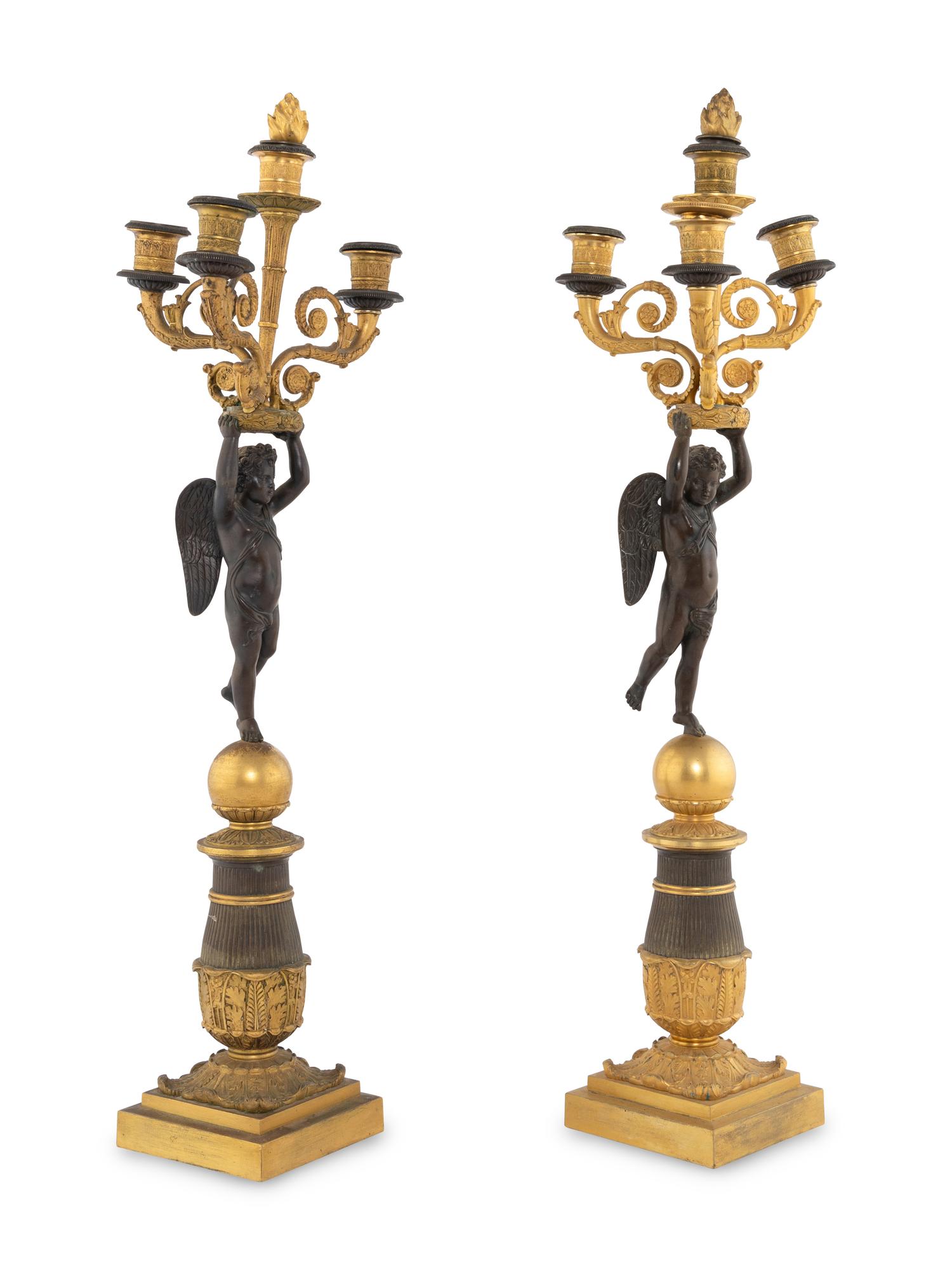 A Pair of Empire Style Gilt and Patinated Bronze Figural Candelabra