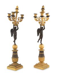 A Pair of Empire Style Gilt and Patinated Bronze Figural Candelabra