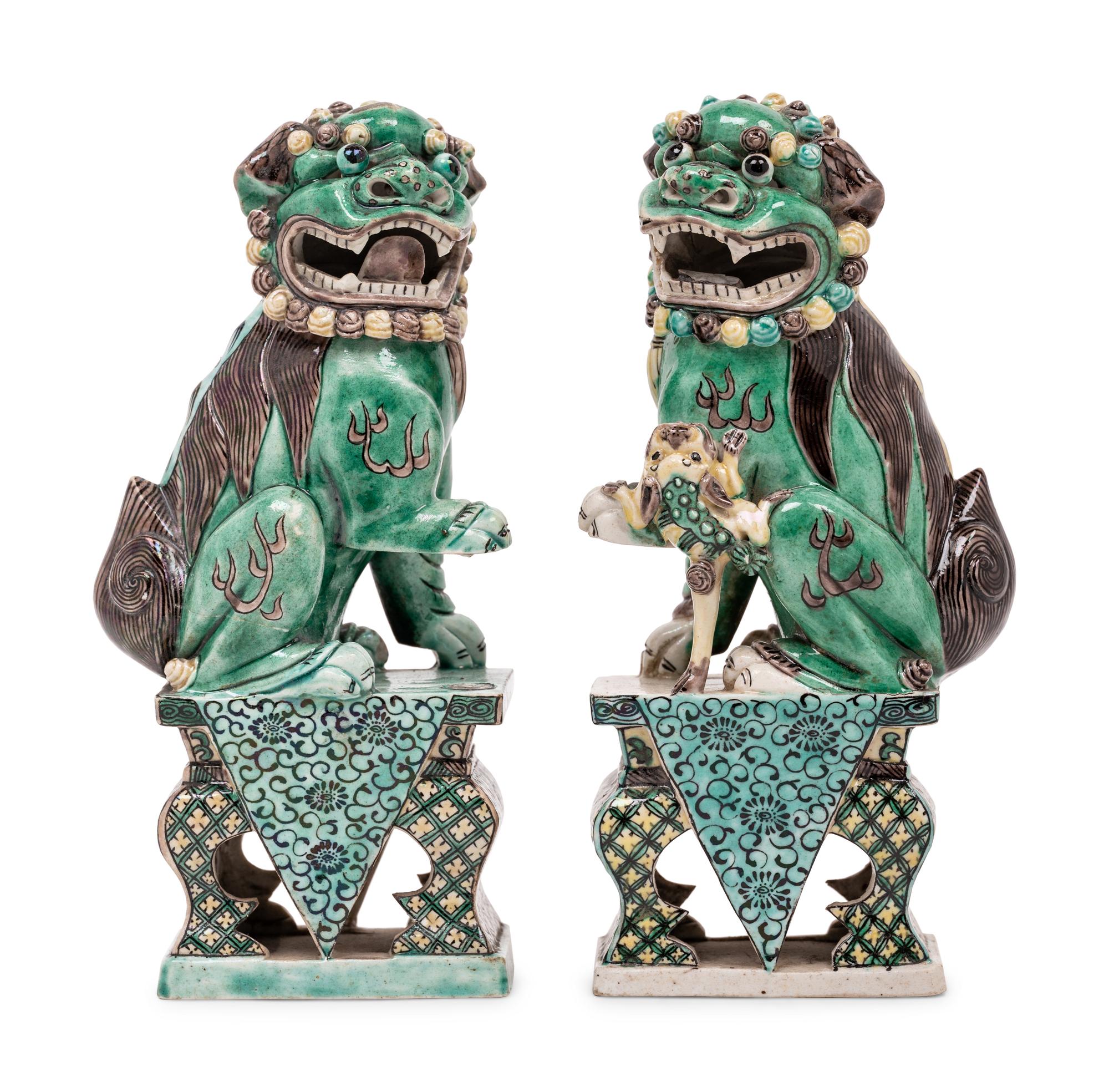A Pair of Chinese Famille Verte Porcelain Figures of Fu Lions