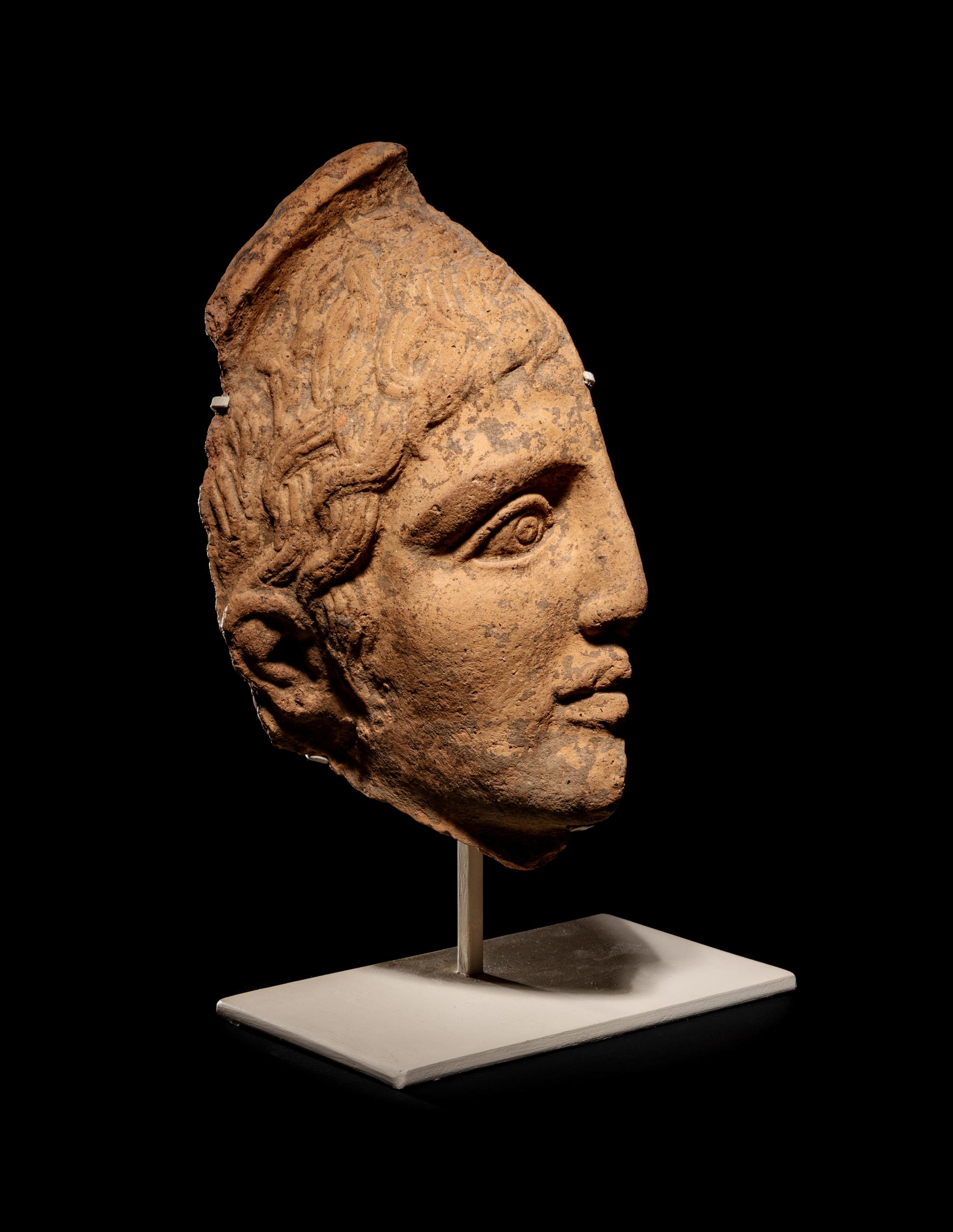 An Etruscan Terra Cotta Votive Half Head
