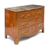 A Régence Style Gilt Bronze Mounted Marble Top Commode