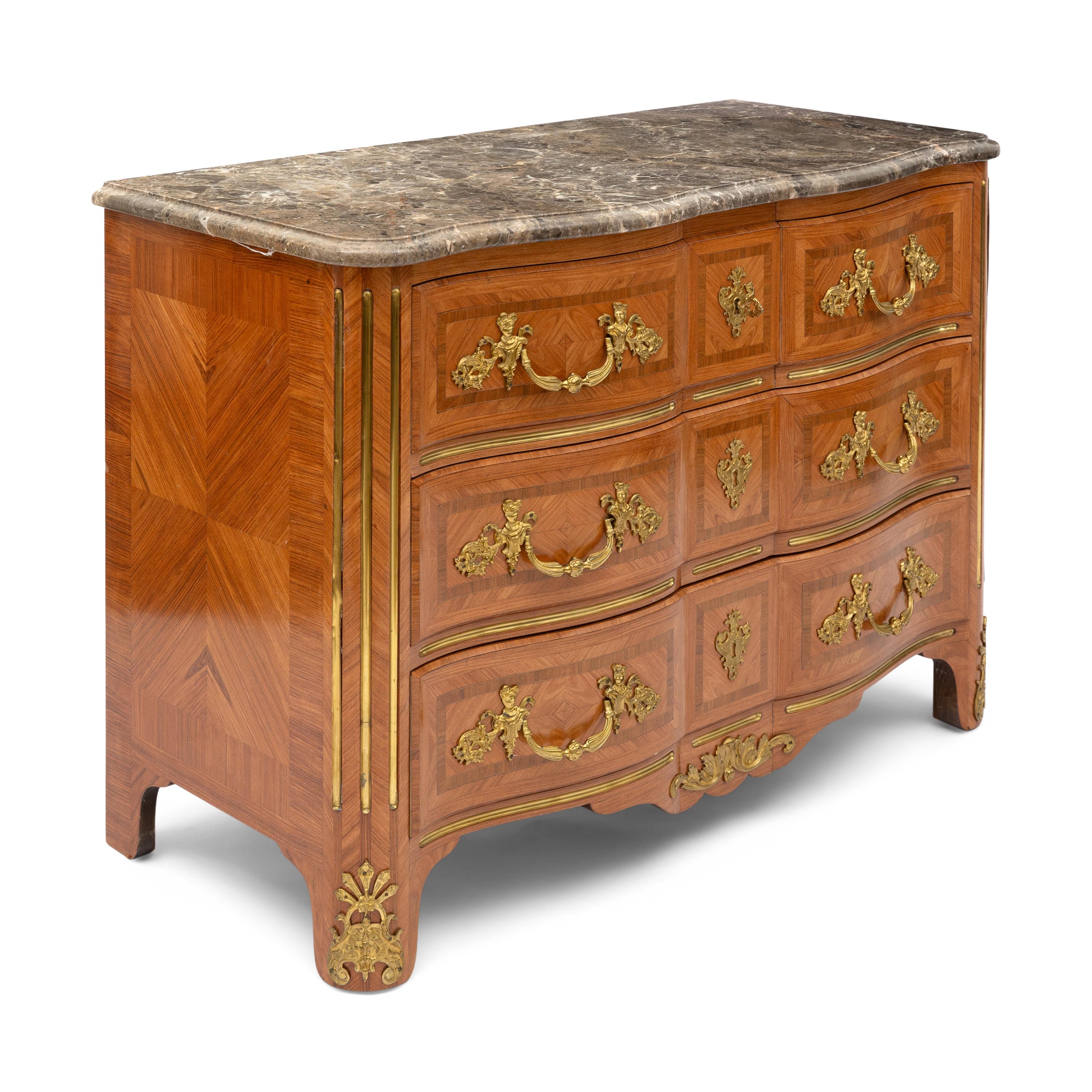 A Régence Style Gilt Bronze Mounted Marble Top Commode