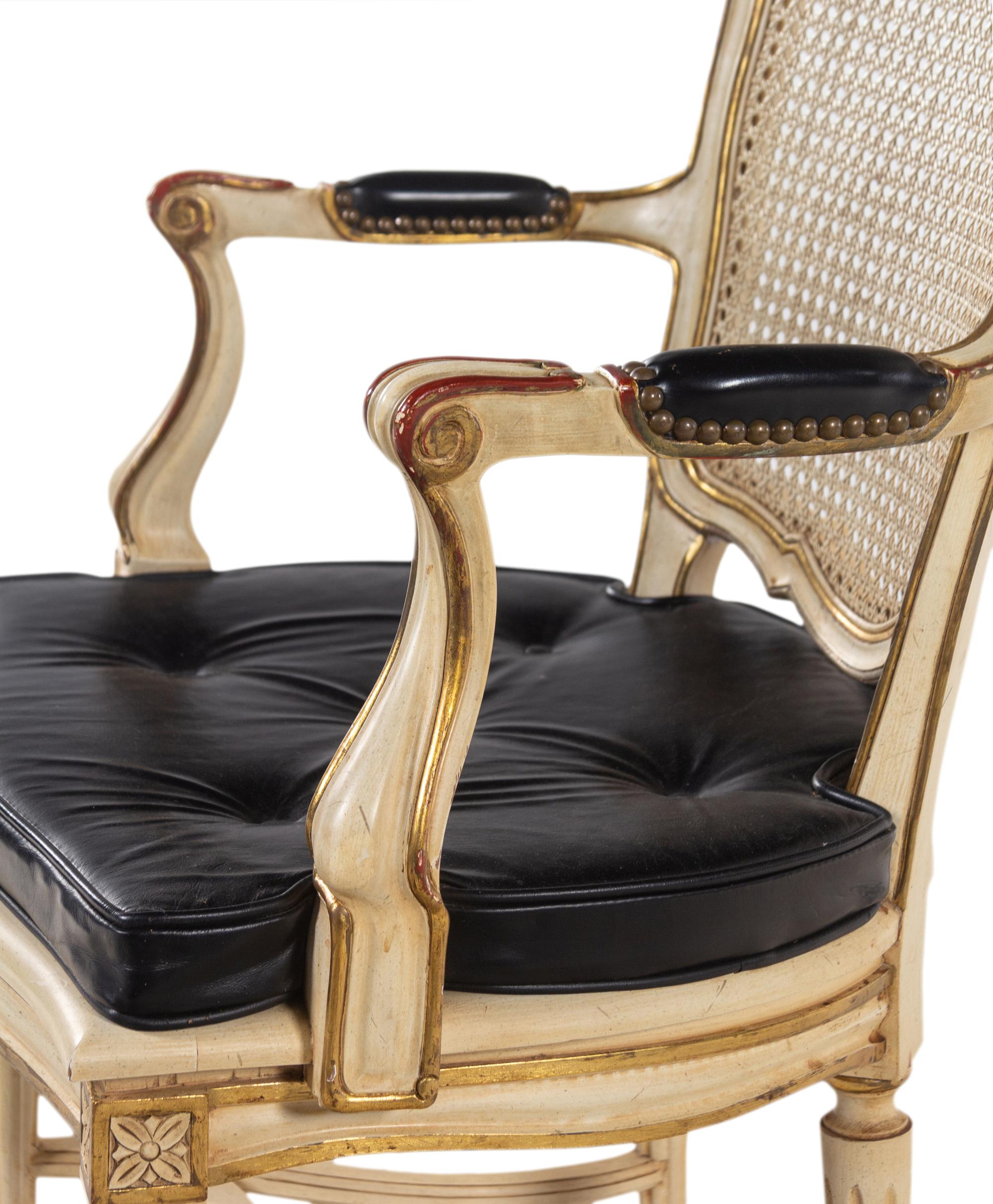 A Pair of Louis XV Style Painted and Caned Fauteuils