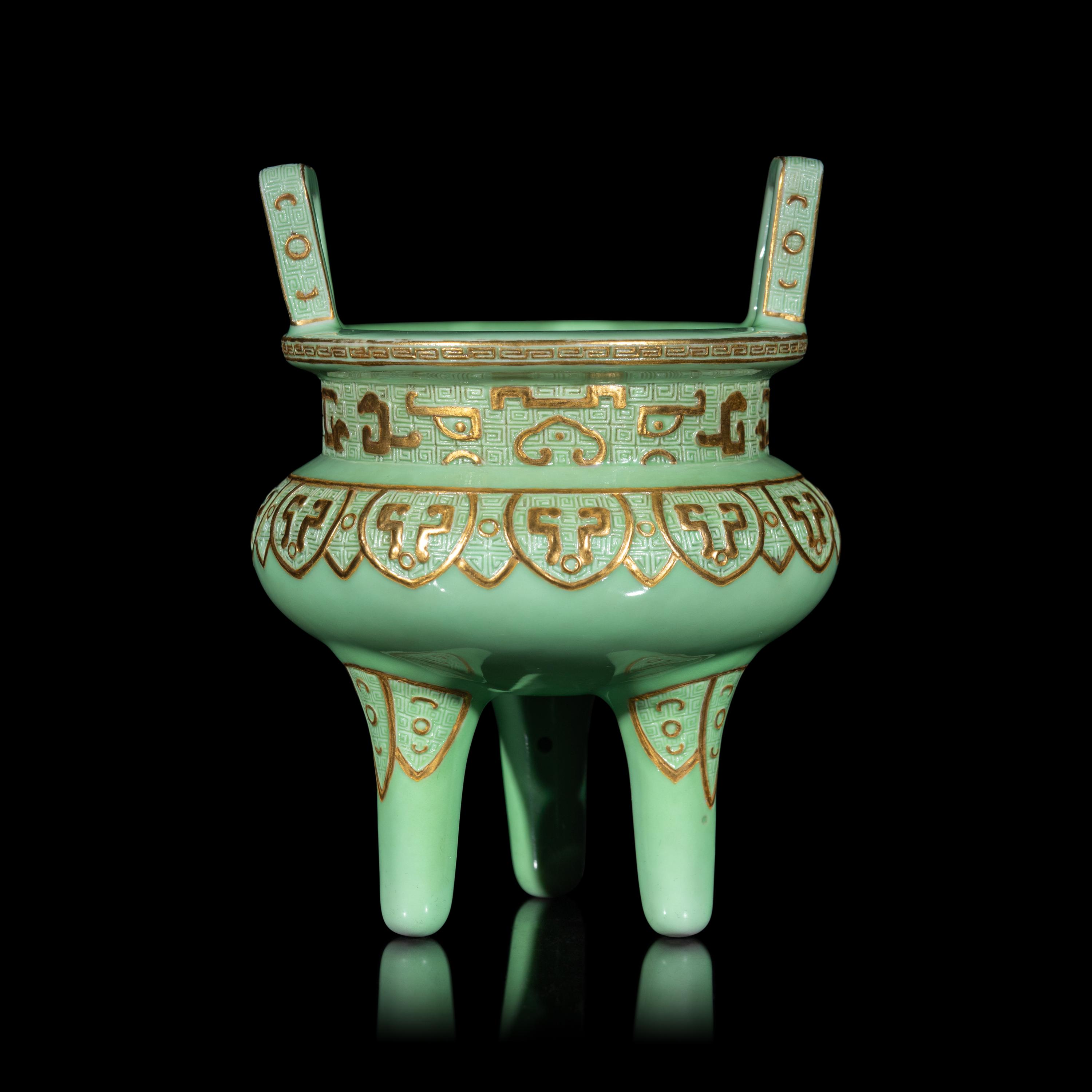 A Chinese Gilt Highlighted Green Glazed Porcelain Ding -Form Censer, Qing Dynasty 清 綠地金彩凸雕仿古鼎式爐
