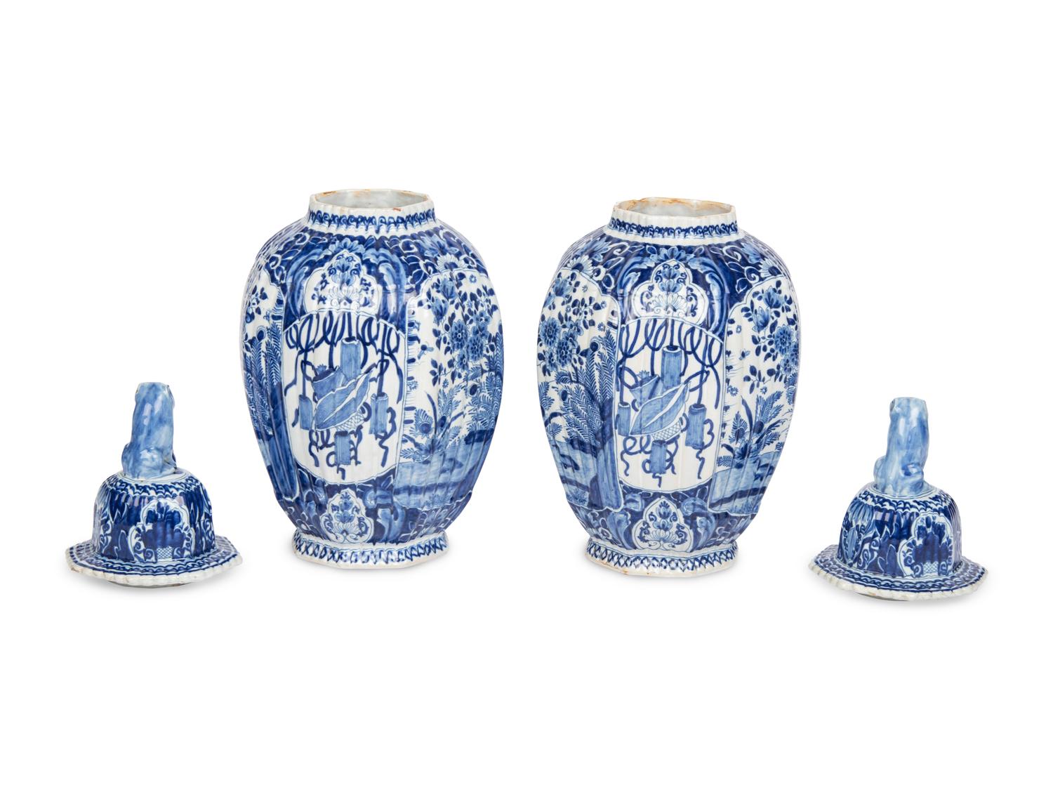 A Pair of Delft Blue and White Covered Jars