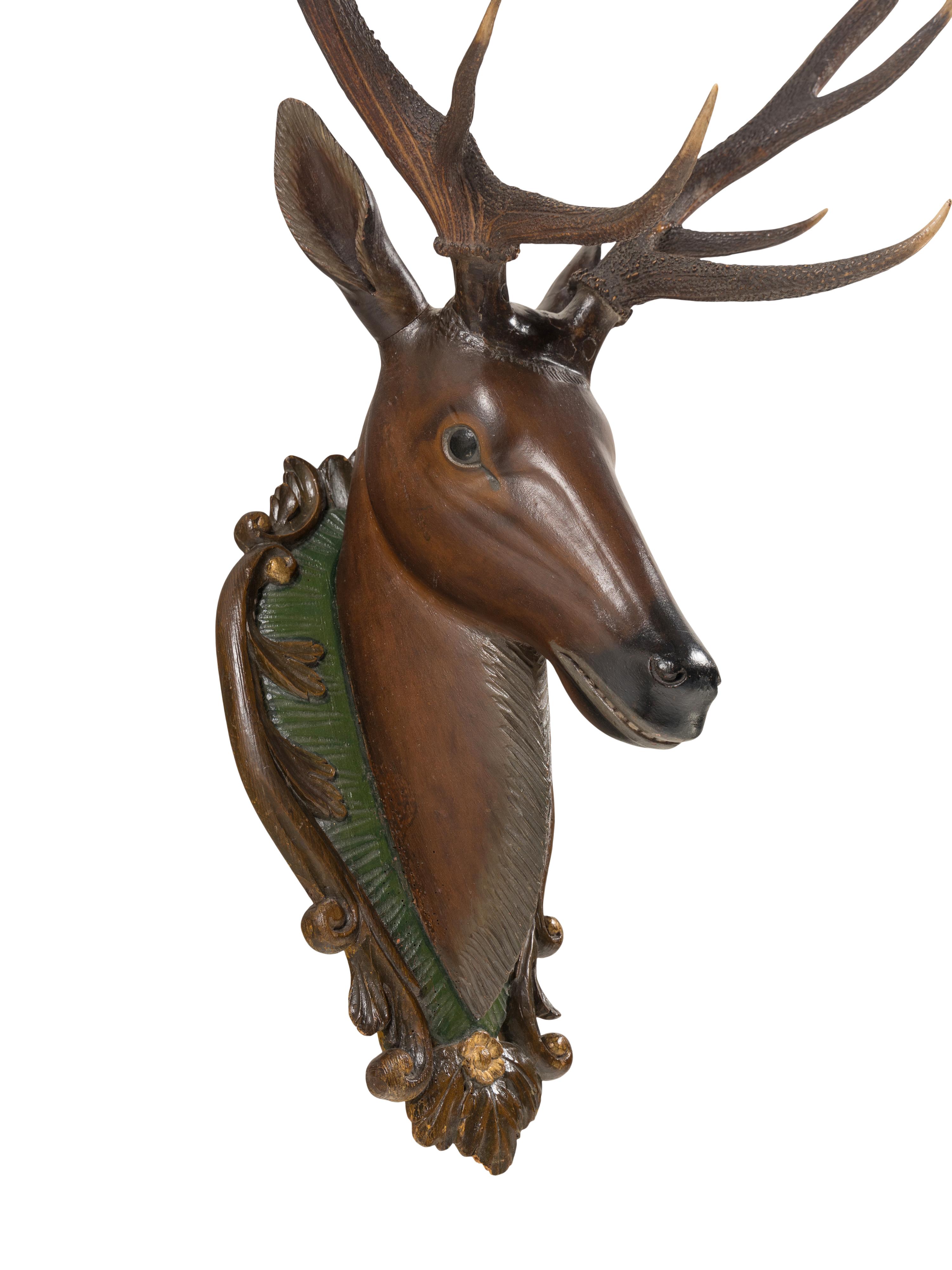 A Swiss 'Black Forest' Carved and Paint-Decorated Stag Head Trophy