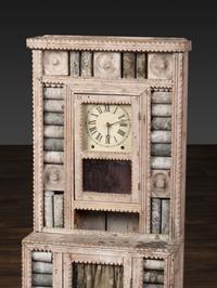A Folk Art Granite Carved and Painted Wood Shelf Clock