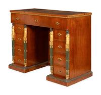 A Continental Empire Style Painted and Parcel-Gilt Mahogany-Veneered Kneehole Desk
